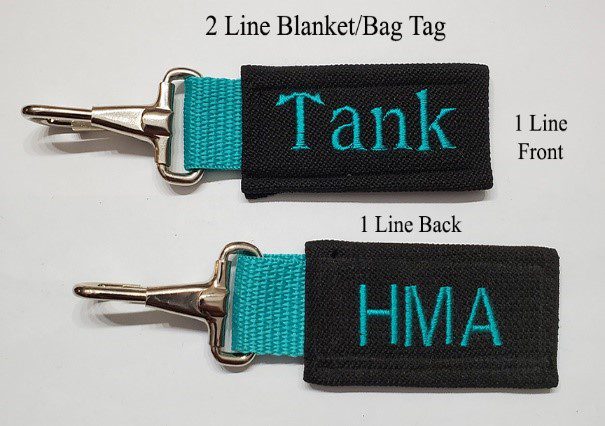 A black and blue tag with the name " tank ".